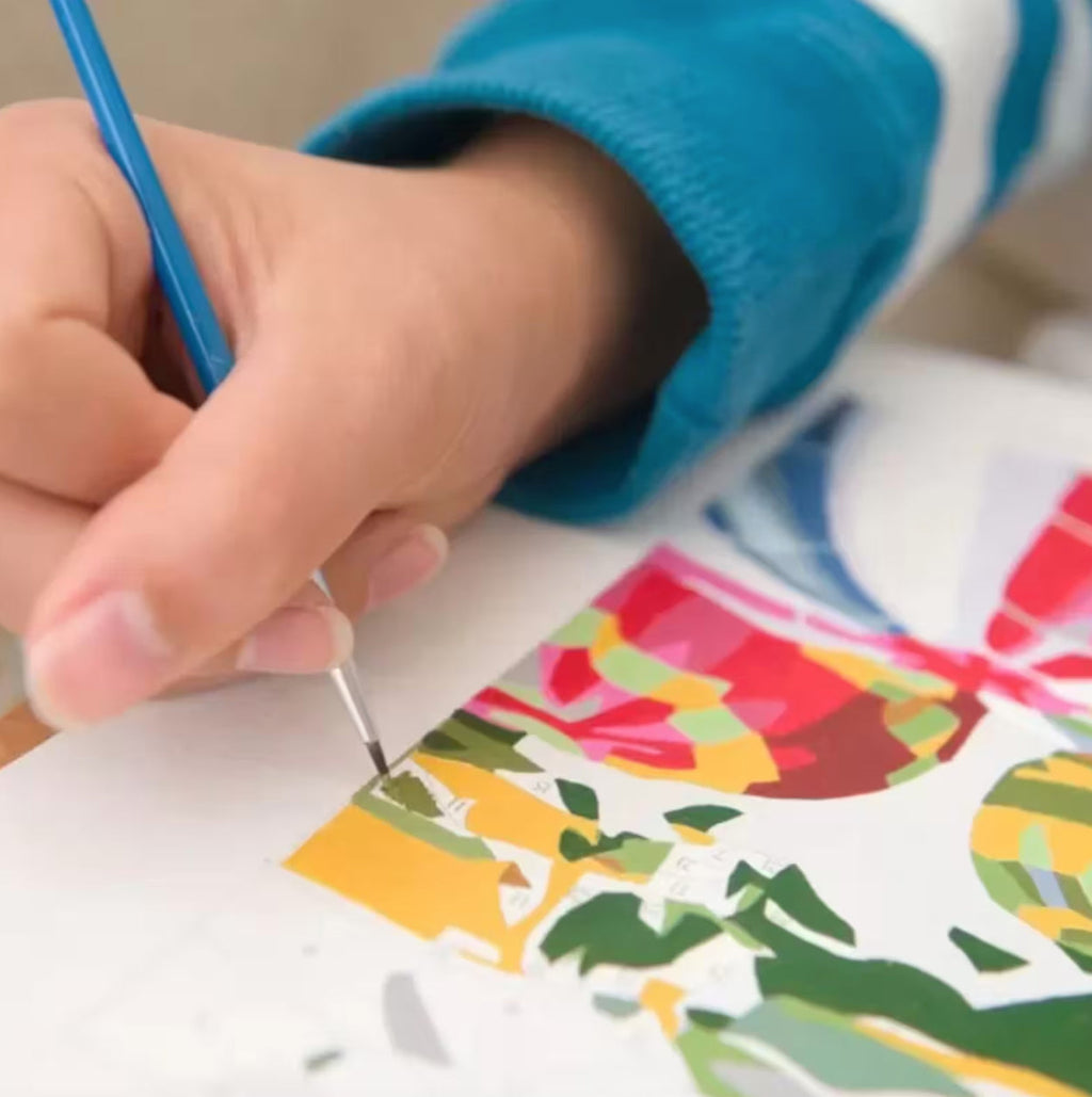 Hand painting one of the numbered sections on the Amalfi Afternoon canvas