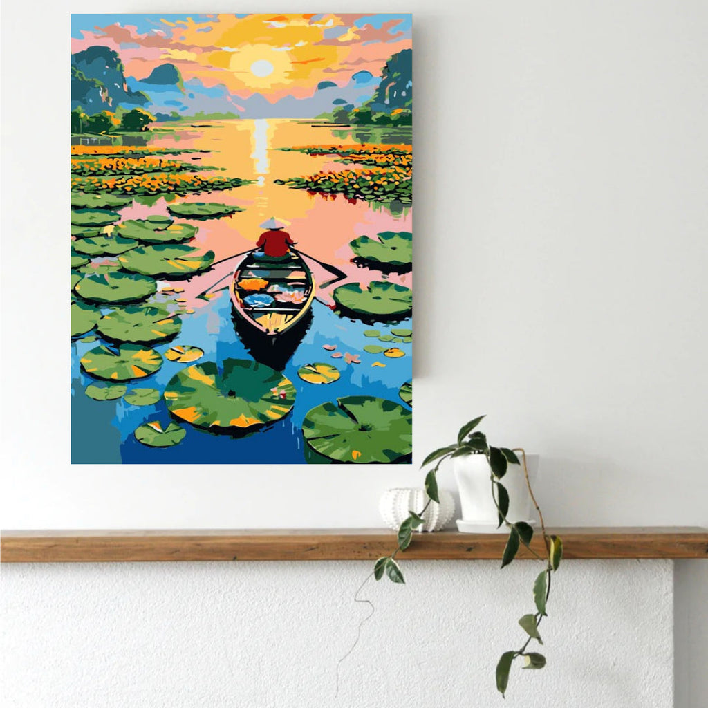 Framed lotus lake paint by numbers canvas displayed in a reading corner