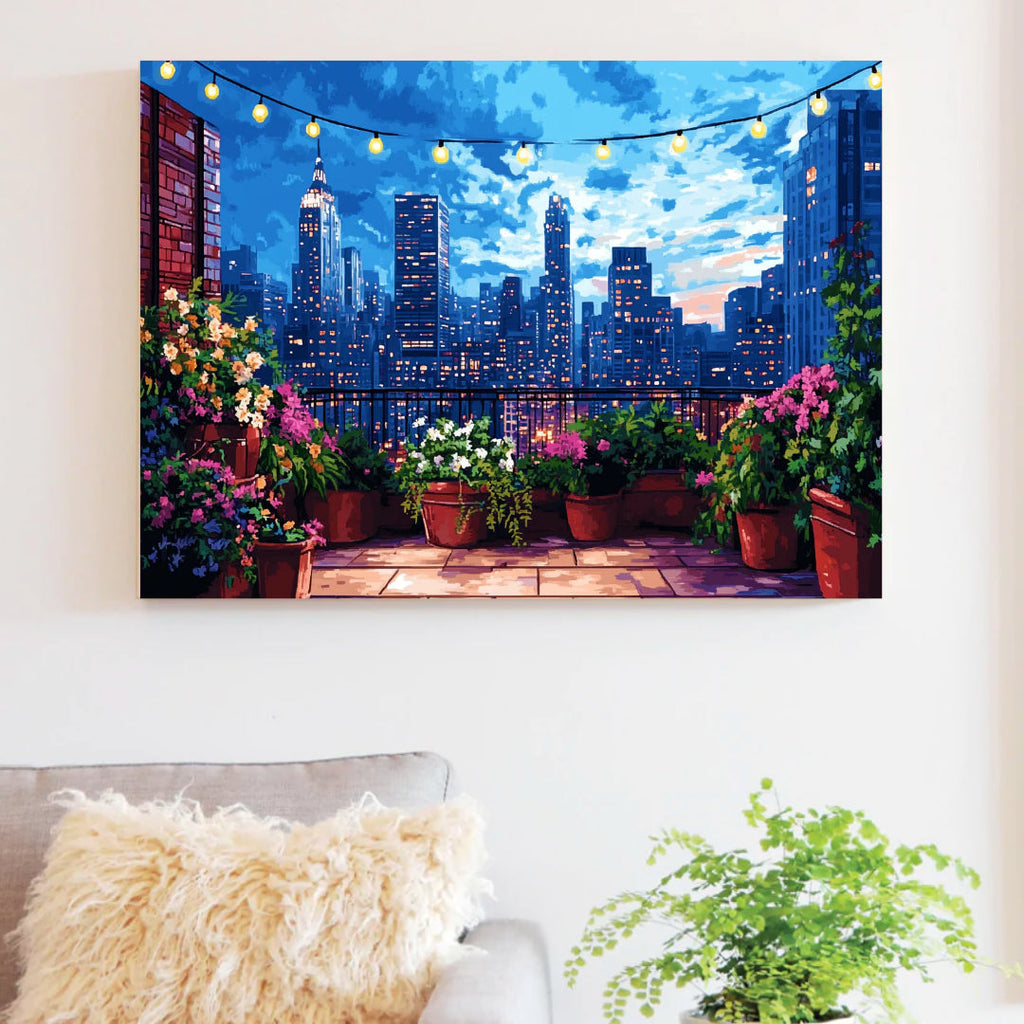 Framed rooftop skyline paint by numbers canvas hung in a living room