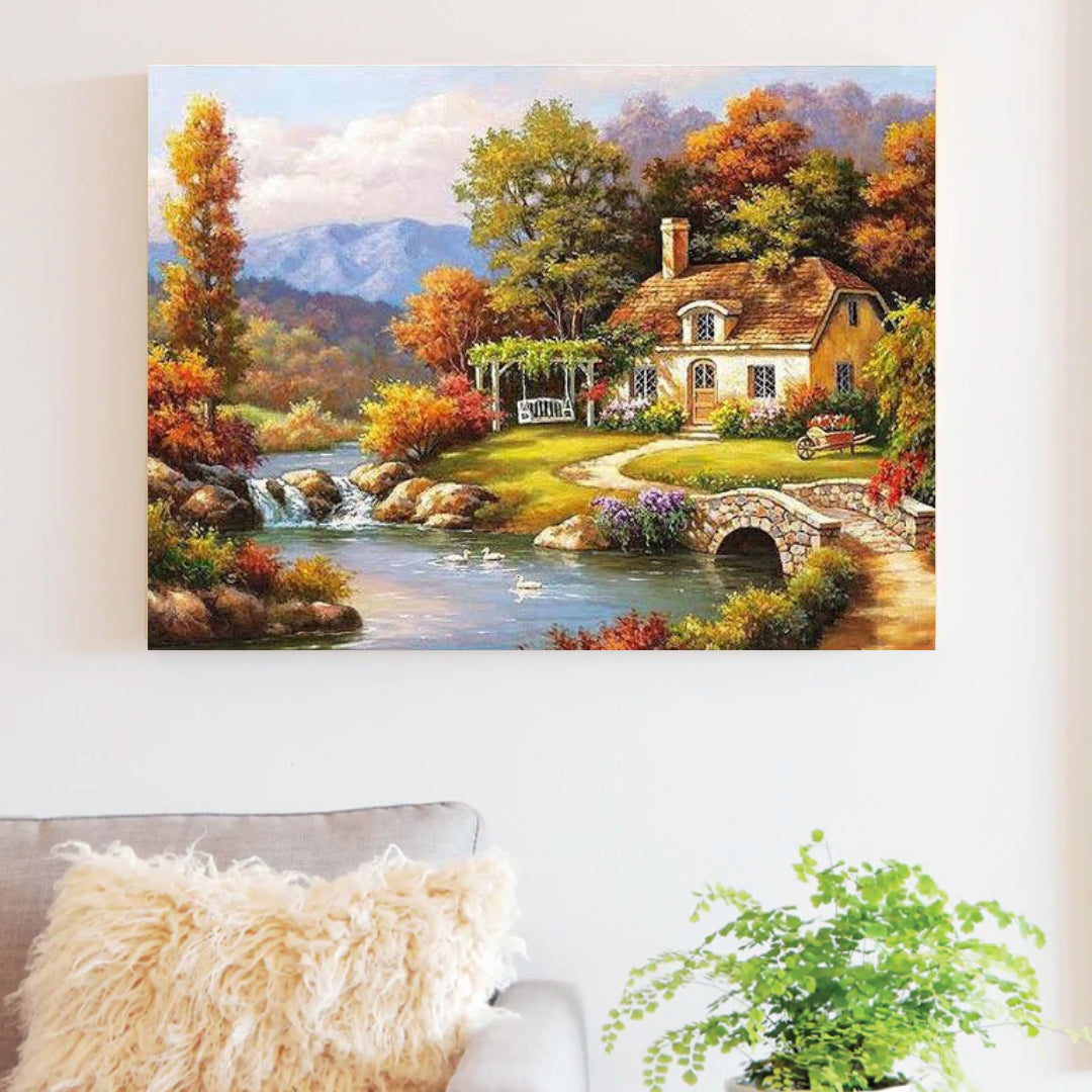 Riverside Cottage paint by numbers canvas mocked up above a sofa